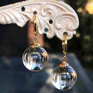Clear orbs of light; round dangle earrings; 1.4 inch drop; .7"orb